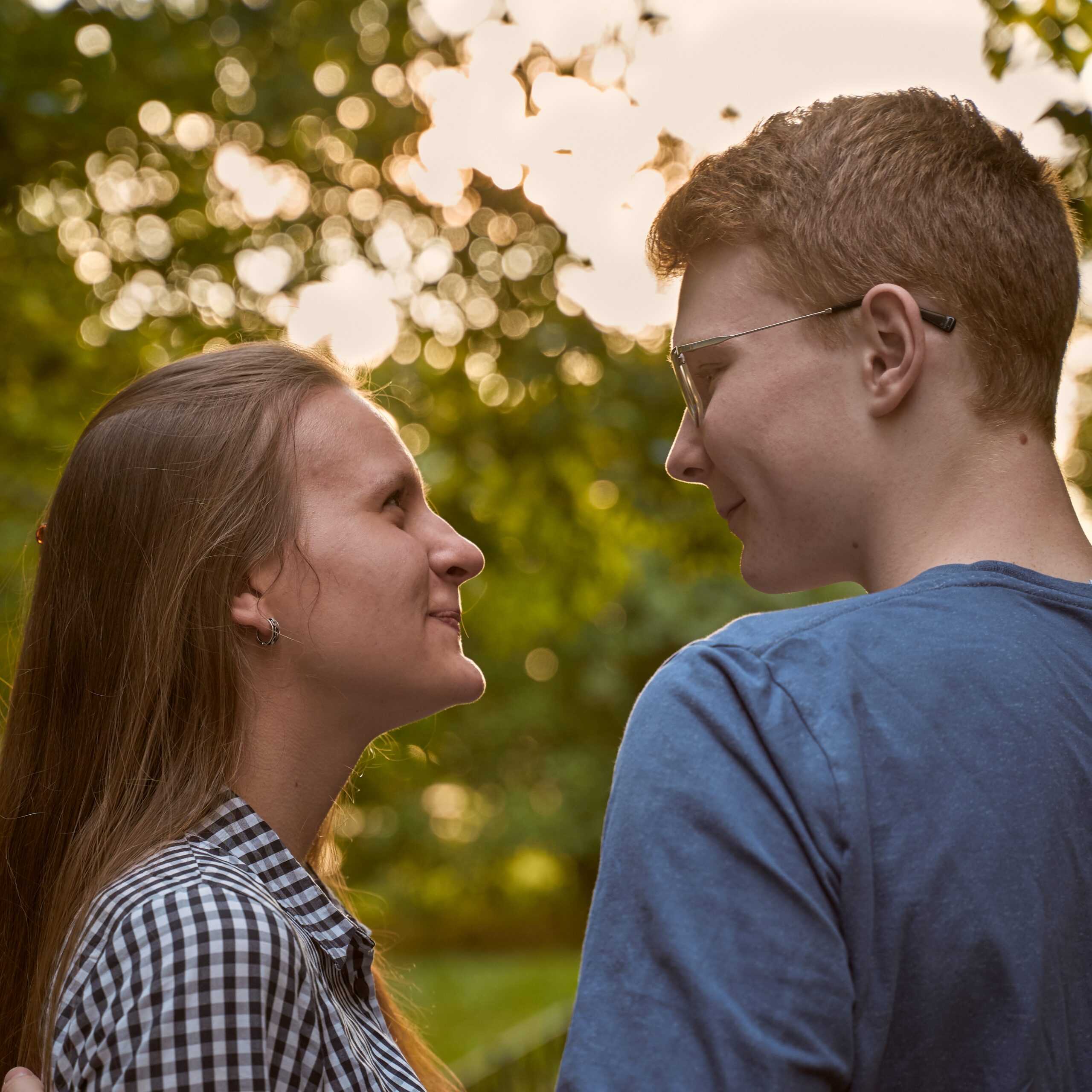 Girlfriend and Boyfriend are looking at each other in the park, concept of love and happiness